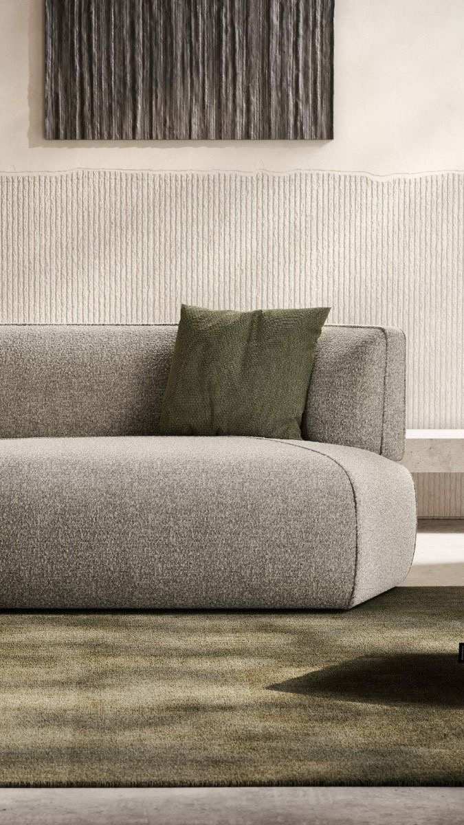 Detail of textured sofa with green cushion